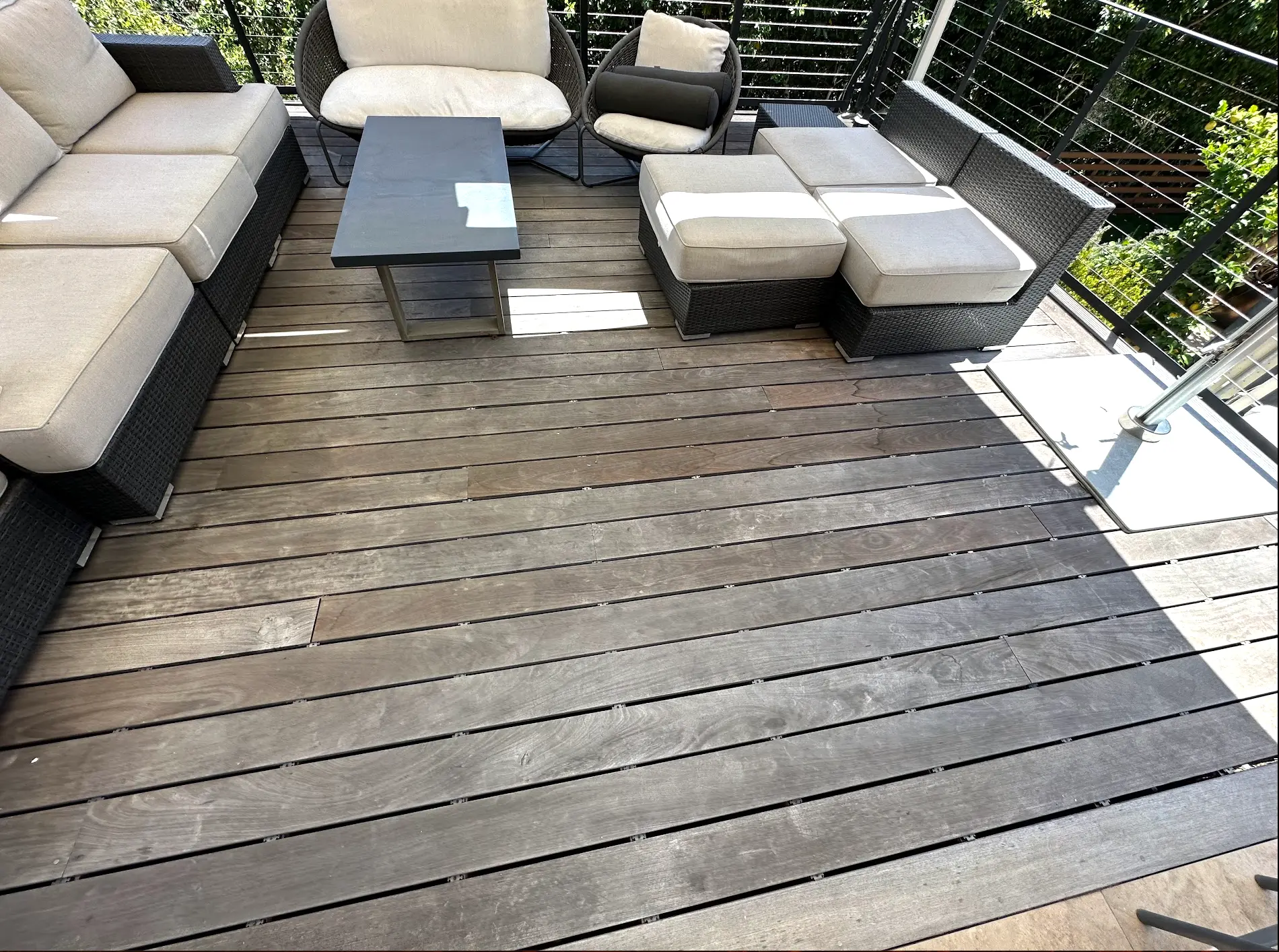 Close view of weathered wood deck boards before PatioMaid restoration in San Diego