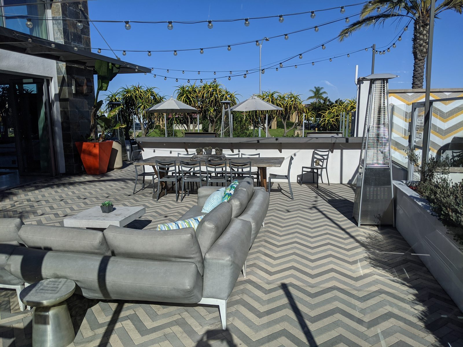Clean rooftop pool deck and outdoor lounge at a San Diego apartment community