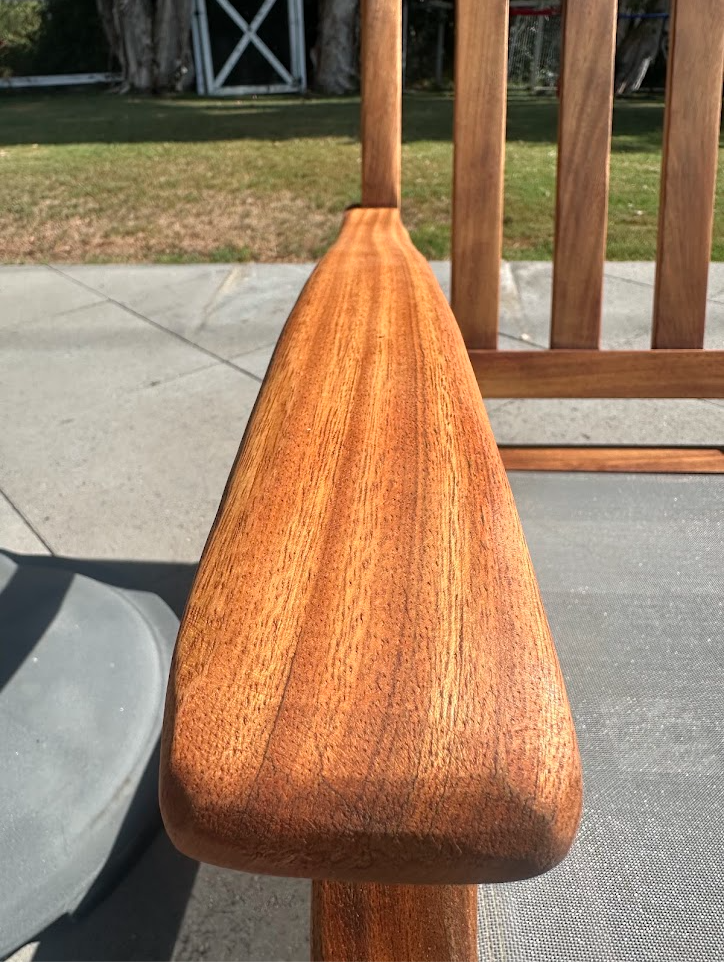 Close view of the teak chair arm after PatioMaid restoration in San Diego