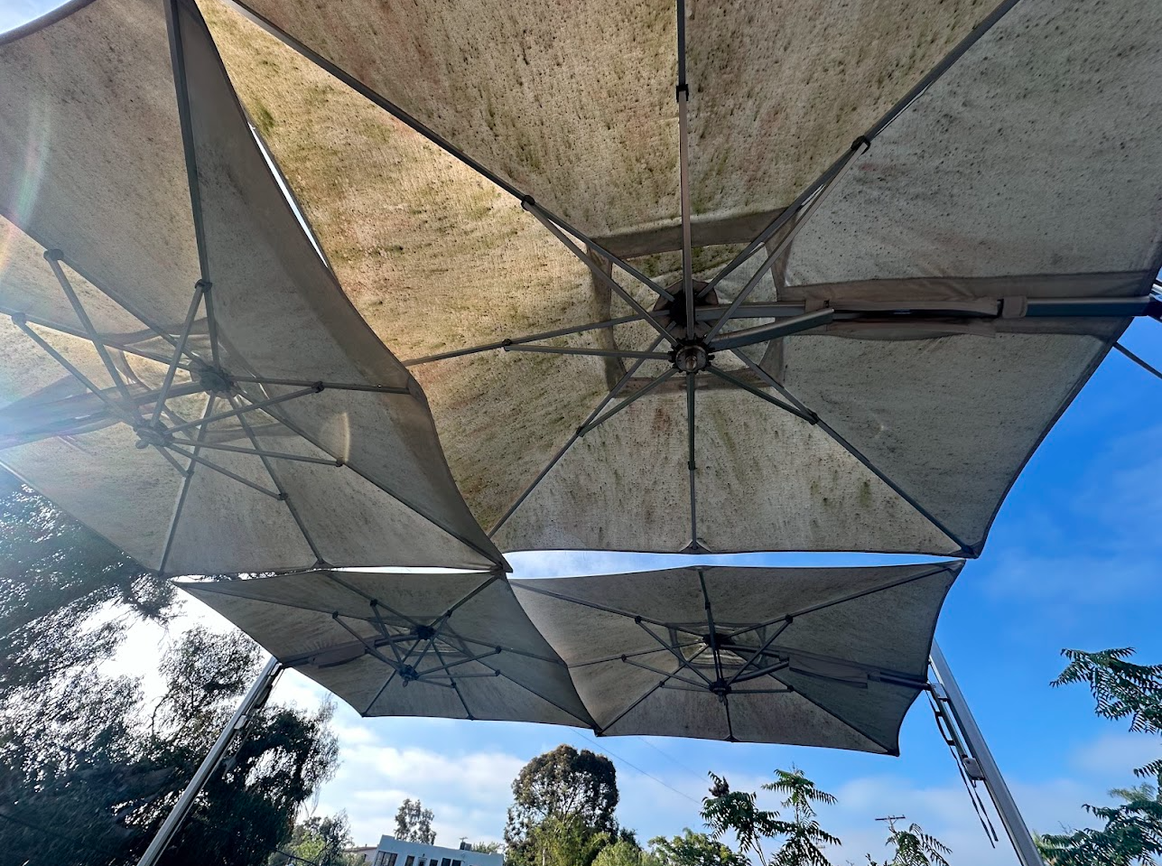 Cantilever umbrella canopy refresh before PatioMaid cleaning in San Diego