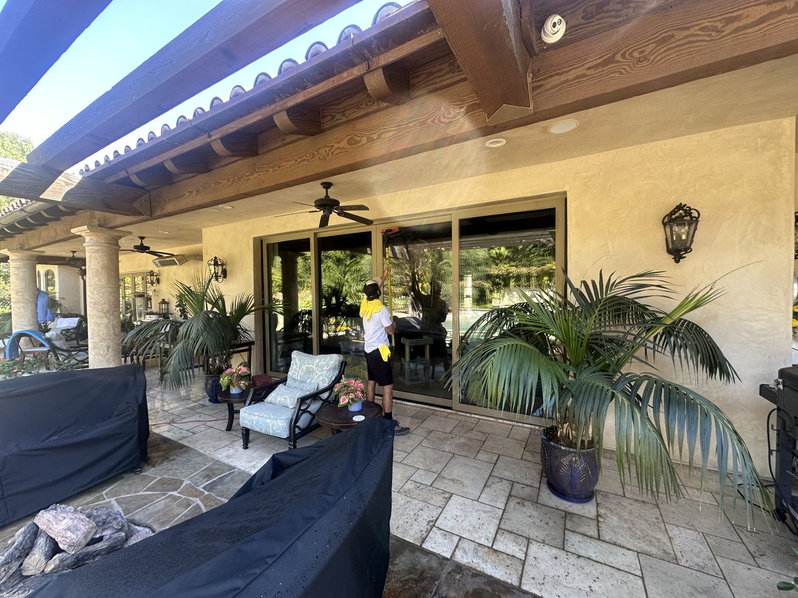 PatioMaid crew working on a covered patio in San Diego