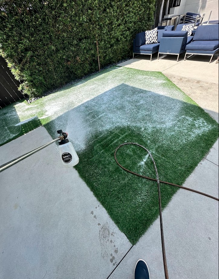 Artificial turf being deep rinsed by PatioMaid at a San Diego home